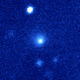 The comet, surrounded by a gaseous cloudy layer, can be seen at the center of this synthetic color composite image.